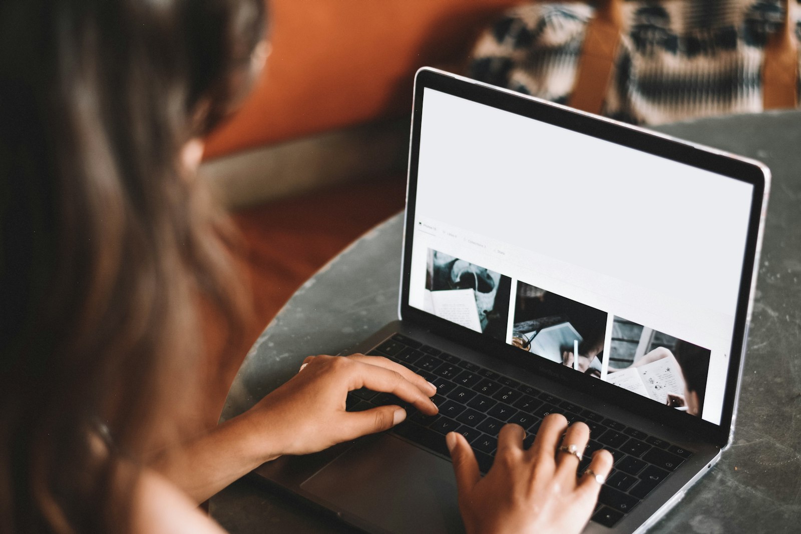 Learner working on a laptop at a table